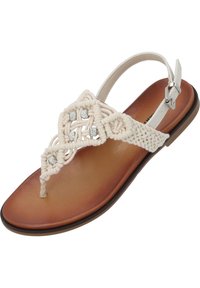 Płaskie sandały na rzemyku z beżową górą macramé z ozdobnymi cyrkoniami oraz brązową wkładką z ekologicznej skóry. W komplecie regulowany pasek na kostkę.