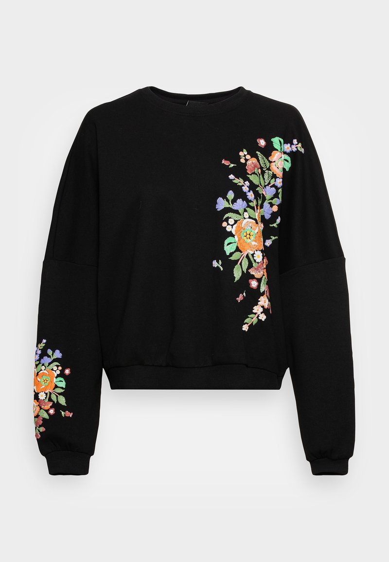 Sweat-shirt noir à manches longues avec broderie florale colorée sur la poitrine droite et la manche gauche, présentant des fleurs orange, violettes, vertes et roses.