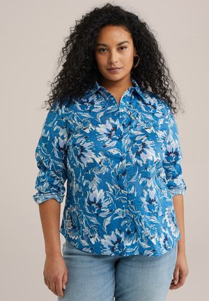 Blue floral button-up shirt with rolled sleeves, featuring white and dark blue flowers. Made of lightweight fabric with a crisp finish.