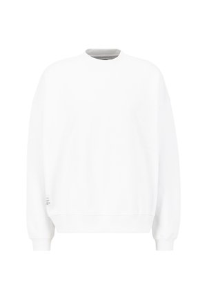 Valge pusake, ümmarguse kaelusega, pikkade varukatega ja ribidega mansettidega. Valmistatud pehmest kangast, millel on sile tekstuur. Minimalistlik disain, ilma mustriteta.