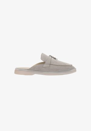 Light grey suede slip-on loafer with a silver metal bit detail and cream rubber sole, side view on white background.