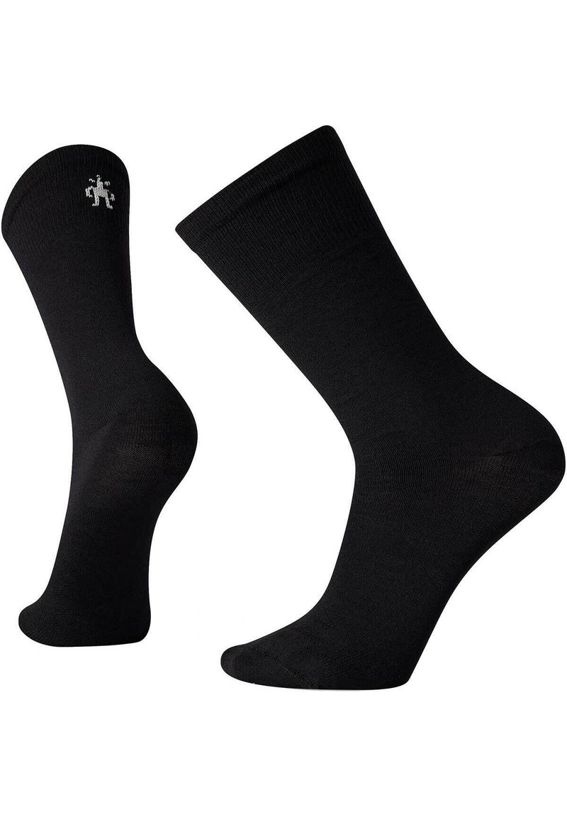 Schwarze Crew-Socken aus glattem Stoff. Mit einem gerippten Bund und einem kleinen, dezenten Logo in der Nähe des Knöchels. Klassisches, vielseitiges Design.