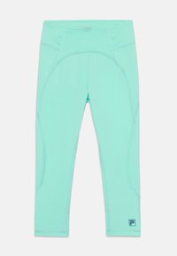 Ανοιχτό μπλε κολάν με ελαστικό υλικό, που διαθέτει καμπύλες ραφές, εφαρμοστή μέση και ένα μικρό λογότυπο κοντά στο κάτω άκρο.