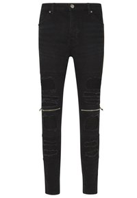 Pantalones vaqueros de mezclilla negra con tela desgastada en las rodillas, textura acanalada y detalles de cremallera en los laterales. Diseño ajustado.