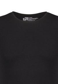 T-shirt noir avec un col rond. Fabriqué en tissu lisse et léger. Présente une marque minimaliste imprimée à l'intérieur du col.