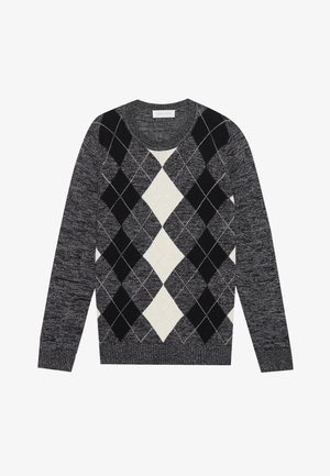 Pull en argyle noir et blanc avec un col rond, fabriqué en tissu tricoté texturé. Manches longues et bords côtelés.