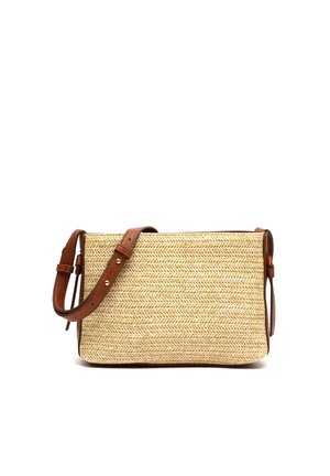 Ristkülikukujuline õlakott, kõrrelisest materjalist, pruuni nahast reguleeritava rihma ja äärisega, millel on heegeldatud siksakmuster.