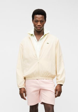 Μπουφάν προπόνησης - naturel clair