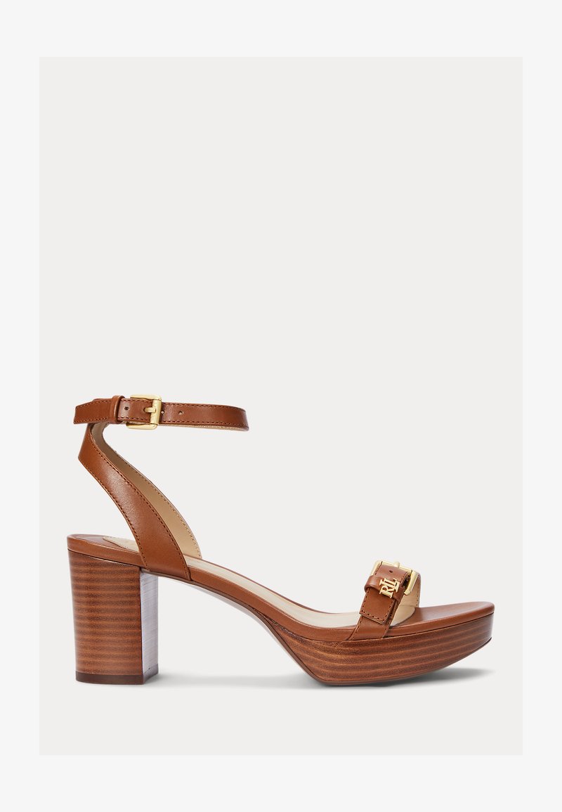 Brown leather high-heeled sandal with a chunky wooden platform. Features a thin ankle strap and a horizontal strap with gold hardware detail.
