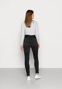 Lindex Maternity TOVA SOFT  - Calças de ganga de corte skinny - black