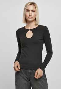 Sort langærmet top fremstillet af glat stof, med en nøglehul-udskæring. Enkel, tætsiddende design med en rund kant.