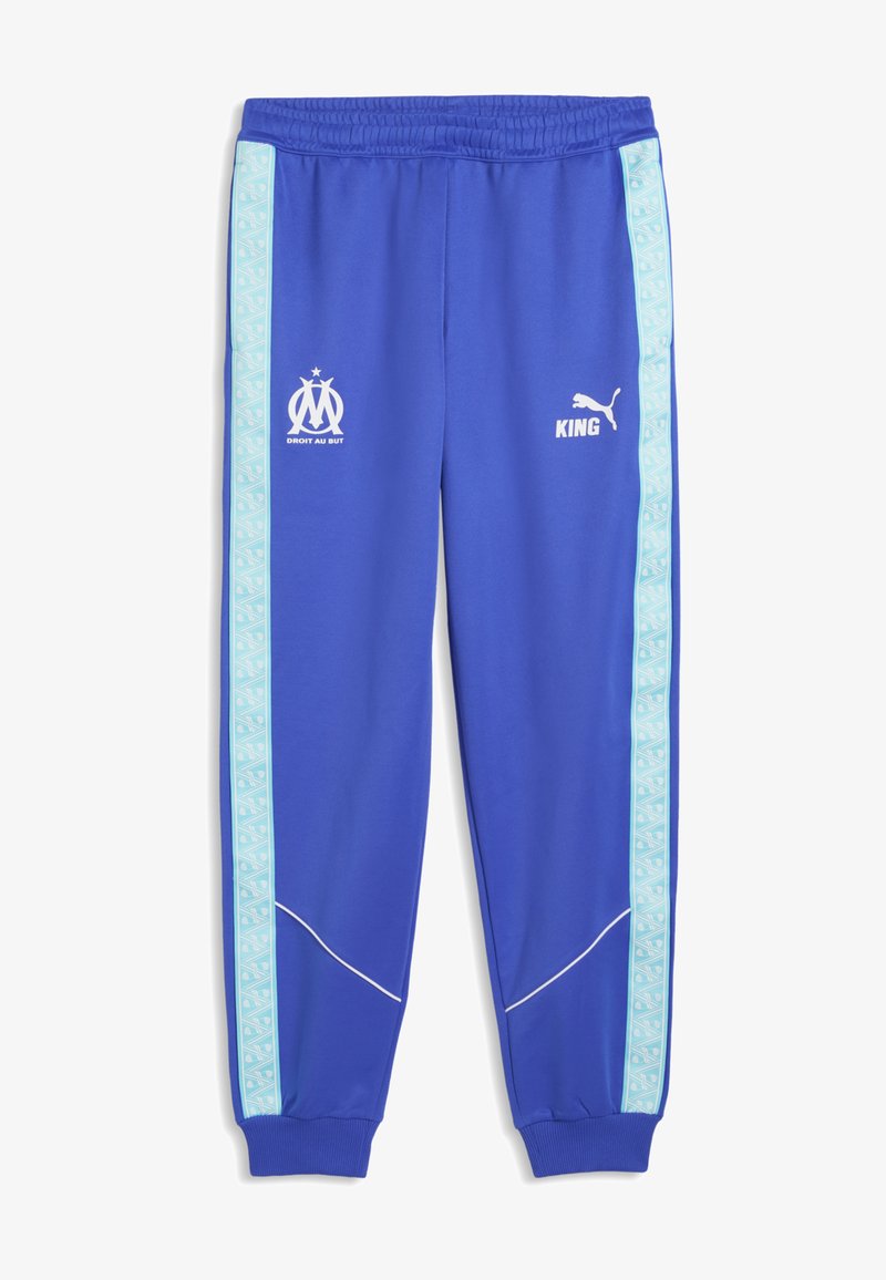 Pantalon de sport bleu avec des bandes latérales à motifs bleu clair, taille et poignets élastiques, logos sportifs blancs et texte "KING" à l'avant.