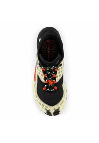 Black and cream lightweight athletic shoe with mesh upper, contrasting orange laces, and textured sole. Features a minimalist design.