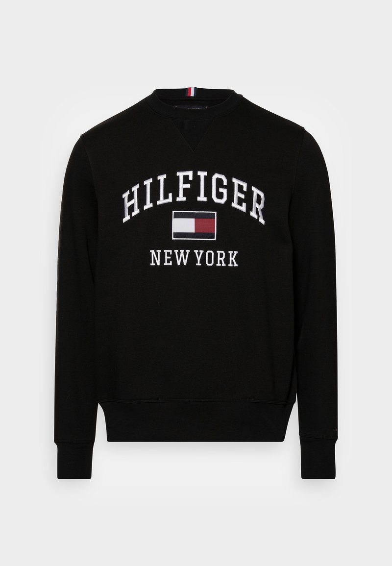 Black sweatshirt with a crew neckline, featuring white embroidered text "HILFIGER NEW YORK" and a red and blue logo patch. Smooth fabric texture.