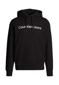 Sudadera negra de tejido suave, con capucha ajustable y un logo blanco de "Calvin Klein Jeans" en la parte delantera.