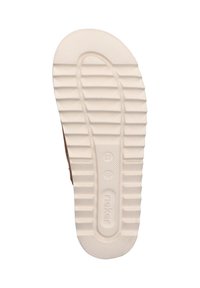 Shoe sole in brown and white rubber, featuring a textured, ridged pattern for grip. Size marked as 37 with brand logo visible.