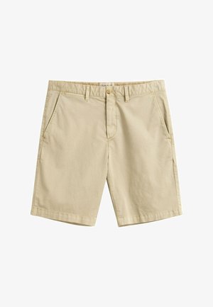 Shorts pour hommes en coton beige avec passants de ceinture, fermeture par bouton, braguette zippée et poches latérales, présentés sur un fond blanc.