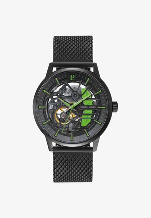 Orologio scheletro nero con accenti verdi, un cinturino in rete testurizzato e un quadrante trasparente che rivela intricati dettagli meccanici.