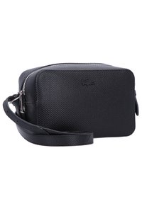 Borsa a tracolla nera in sintetico con superficie texture, forma rettangolare, chiusura con zip e tracolla regolabile. Presenta un logo discreto.