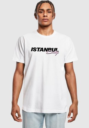 White cotton t-shirt featuring "ISTANBUL" in bold black font and "City" in pink script, round neckline, and short sleeves.