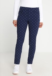 Marinblå byxor med ett subtilt mönster av vita trianglar över hela ytan. Slät tyg, slim fit, med framfickor och medelhög midja.