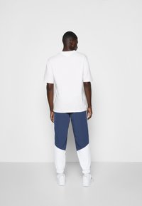 Tommy Jeans PRINTED ARCHIVE TEE - T-shirt con stampa - white