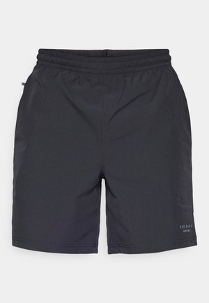 Calções pretos, leves, com uma cintura elástica, textura suave, bolsos laterais e um pequeno logótipo na parte inferior da perna direita.