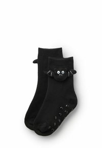 Czarne skarpetki do kostek z miękkim czarnym wzorem nietoperza na mankiecie, z gumowymi kropkami na podeszwie dla lepszej przyczepności.