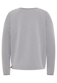 Felpa grigia chiara con vestibilità rilassata, maniche raglan e scollatura arrotondata. Presenta una superficie liscia e dettaglio dell'orlo regolabile.