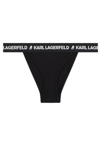 Čierne tangá s bielym elastickým pásom, na ktorom je text "KARL LAGERFELD" a logo. Hladká tkanina, minimalistický dizajn.