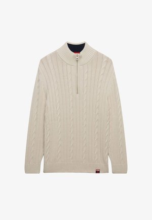 Suéter de punto color crema con un cuello alto, cierre de cuarto de cremallera y un patrón de cable texturizado. Incluye puños y dobladillo acanalados.