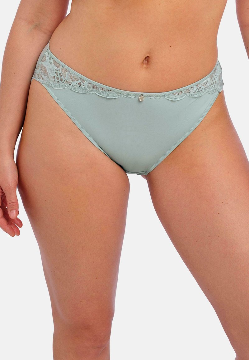 Lichtgroene damesonderbroek met een kanten tailleband, een gladde stof en een kleine decoratieve accent aan de voorkant.