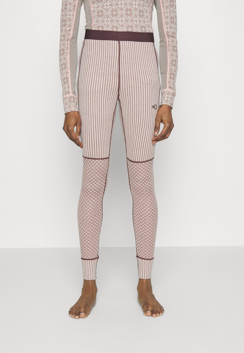 Mehrfarbige thermo Leggings in Hellrosa mit gestreiften und geometrischen Mustern. Mit einer figurschmeichelnden Passform und einem kontrastierenden dunklen Bund.