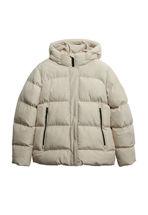 Beige puffer jacket with a hood, featuring quilted segments, two side zip pockets, and a front zipper, made from lightweight synthetic material.