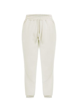 Lys beige, tapered joggers lavet af blødt stof med elastisk talje og manchetter, der har buede sømdetaljer på siderne.