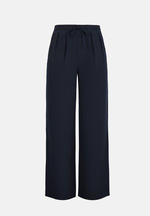 Pantalon large bleu marine avec plis, taille élastique et cordon de serrage réglable, présenté sur un fond uni.