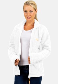 Witte fleecejas met een gestructureerd oppervlak, ritssluiting en oranje hardwareaccenten. Heeft een opstaande kraag en een gezellige, oversized pasvorm.