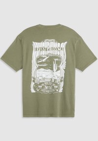 Olive green cotton t-shirt featuring a white graphic print with a desert landscape and text "Levi Strauss & Co." on the back.