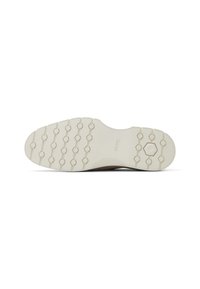 Suela de zapato con un material de goma beige, con un diseño de tracción hexagonal y una forma curva suave. Acabado texturizado a lo largo de los bordes.