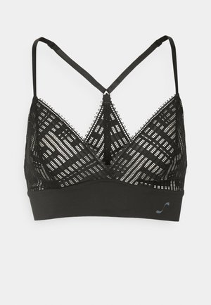 Bralet negru din dantelă geometrică semi-transparentă, cu bretele ajustabile și o bandă inferioară netedă. Prezintă un design triunghiular cu decolteu adânc și margini zimțate.