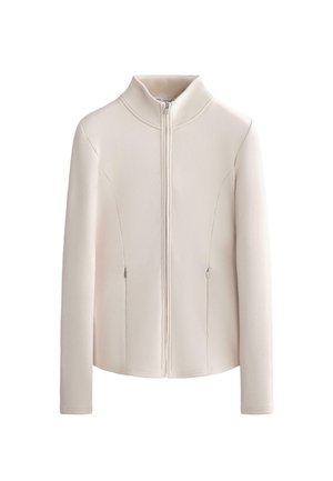 Cremefarvet jakke med lynlås, høj krave, lange ærmer og to lodrette lynlåslommer.