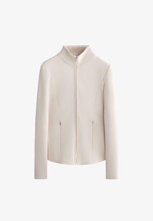 Cream-colored zip-up jacket with high collar, long sleeves, and two vertical zippered side pockets.