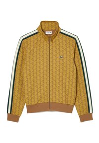 Veste jaune à fermeture éclair avec un motif répétitif, des rayures contrastantes vertes et blanches sur les manches, et un petit logo sur la poitrine.