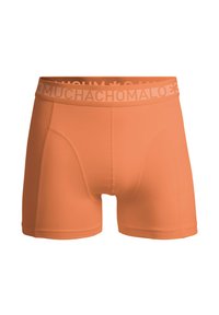 Narancssárga boxeralsó rugalmas anyagból. Jellemzője a "MUCHACHO" márkázott derékszíj világos színben és a testhez simuló fazon.