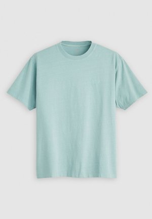 Light blue crew-neck t-shirt made of cotton, featuring short sleeves and a small logo on the left chest area. Smooth texture.