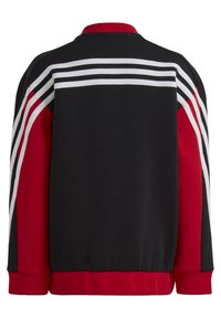 Black and red sweatshirt with white stripes across the back and shoulders. Ribbed collar and cuffs, featuring a relaxed fit and smooth texture.
