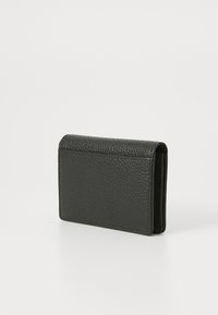 Black textured leather wallet with a rectangular shape. Features a fold-over flap and minimalistic design, emphasizing durability and functionality.