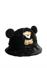 Sombrero tipo pescador de felpa negra con orejas redondas y un gráfico de oso en la parte frontal. Textura suave con ala flexible y sin herrajes visibles.