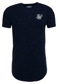 Námořnická modrá tričko vyrobené z texturovaného materiálu, zdobené skvrnitým vzorem a malým bílým logem na levé hrudi. Krátké rukávy a kulatý výstřih.