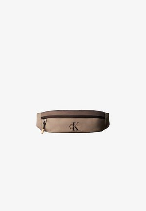 Beżowo-brązowa nerka Calvin Klein z przednim zamkiem błyskawicznym i czarnym suwakiem, z logo Calvin Klein z przodu.